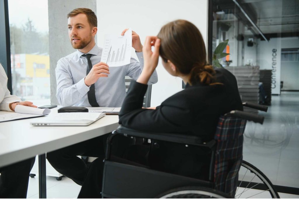 Employee raising her hand during a workplace meeting