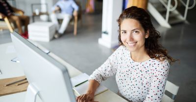 Employee working at a computer in an office