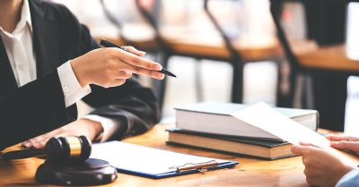Legal advisers reviewing documents at a meeting